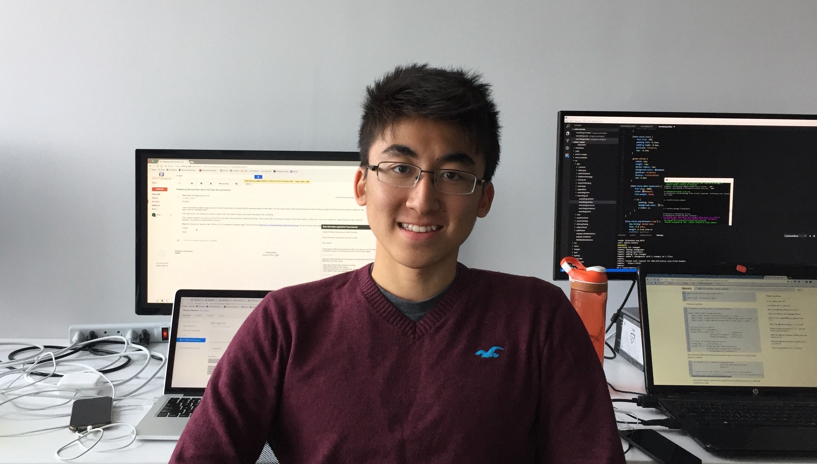 Ethan Xue in front of his computer 