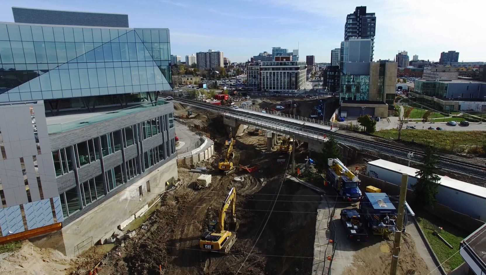 View of King Street under construction with the Google Waterloo building and a train overpass