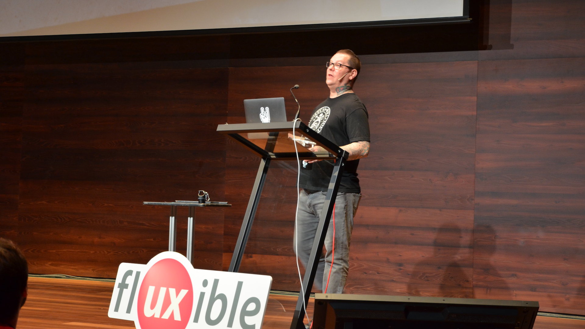 Aaron Irizarry stands at a podium on the Fluxible stage in 2017.