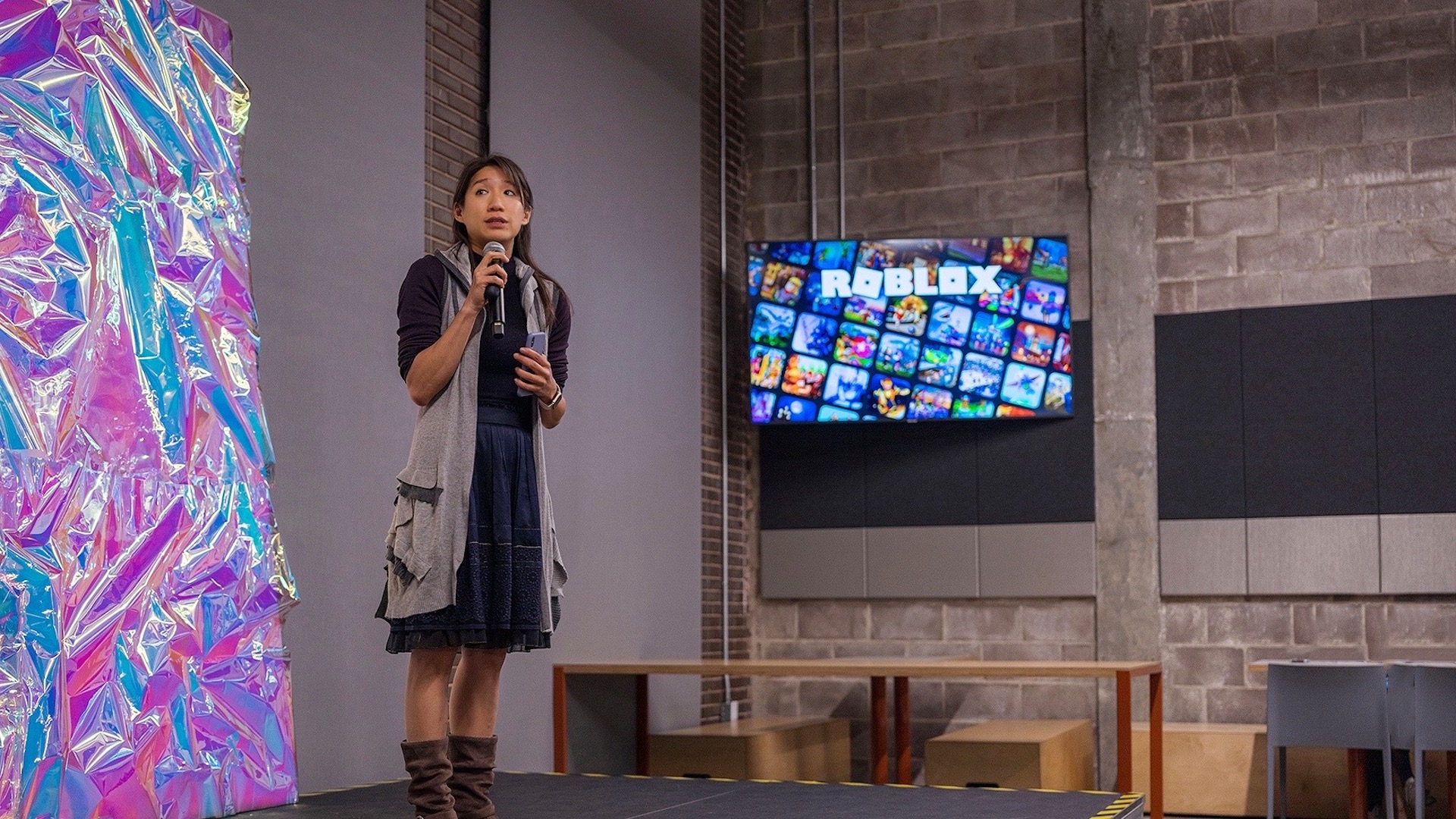 Carina Ngai talks into a microphone.