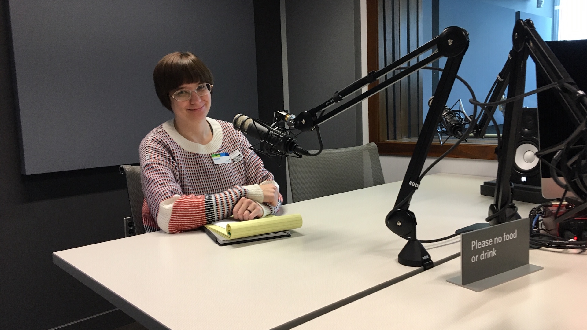 Heffner Studio manager Amanda Wilk sits at a microphone inside one of the recording studios at the Kitchener Public Library.