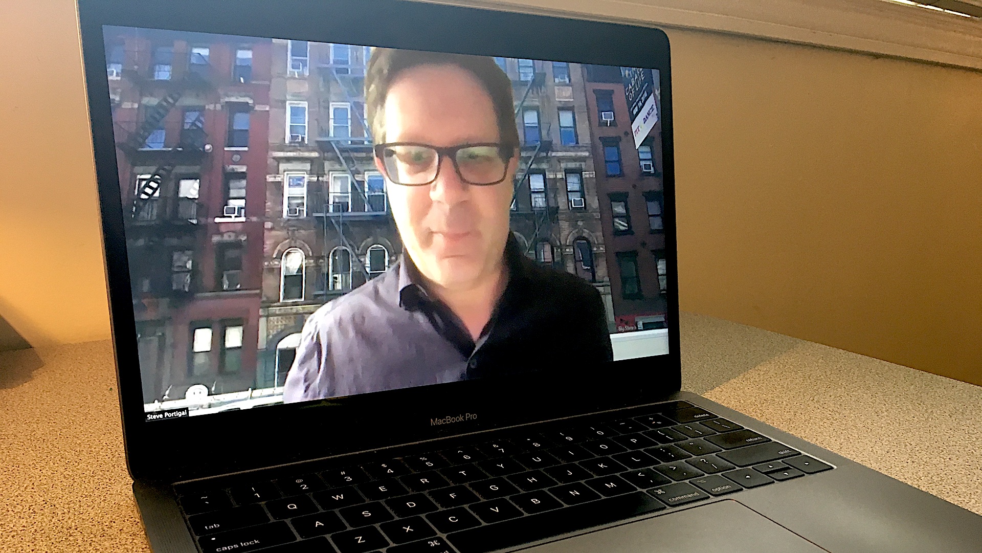 UX researcher Steve Portigal on a laptop screen.