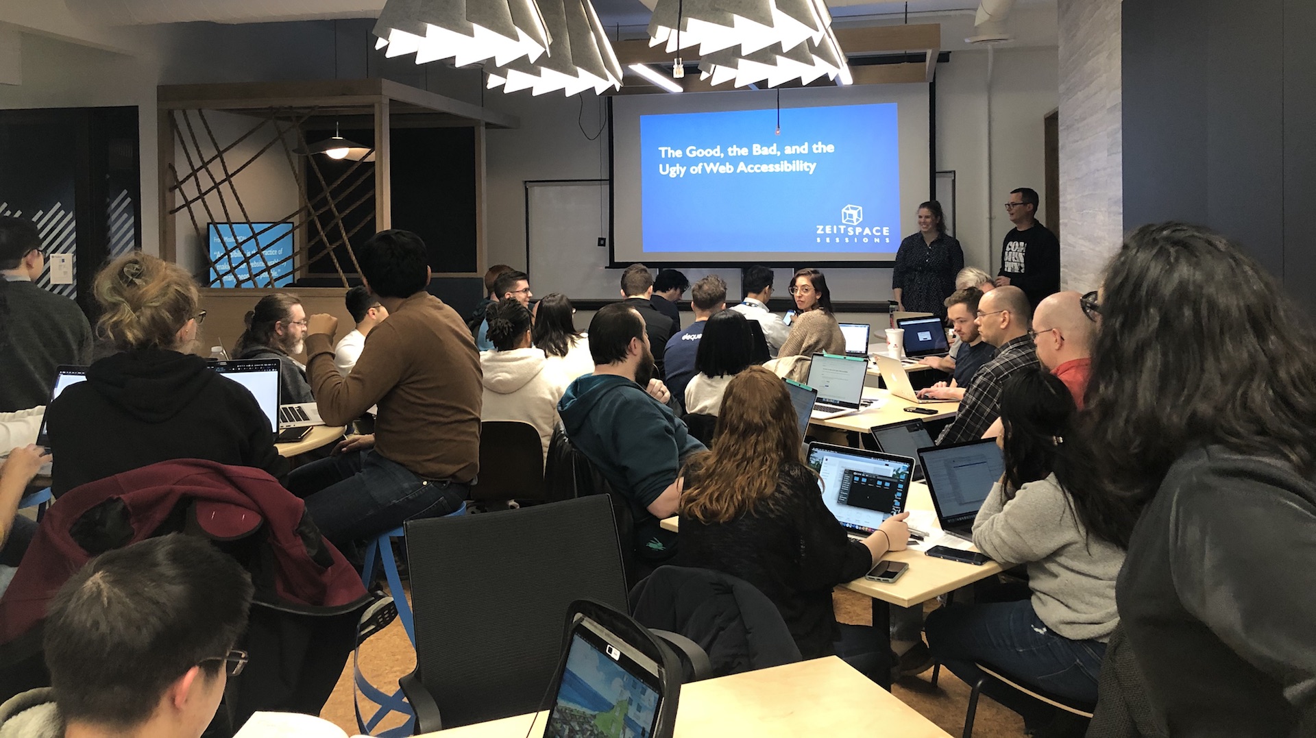 A room full of people with open laptops.